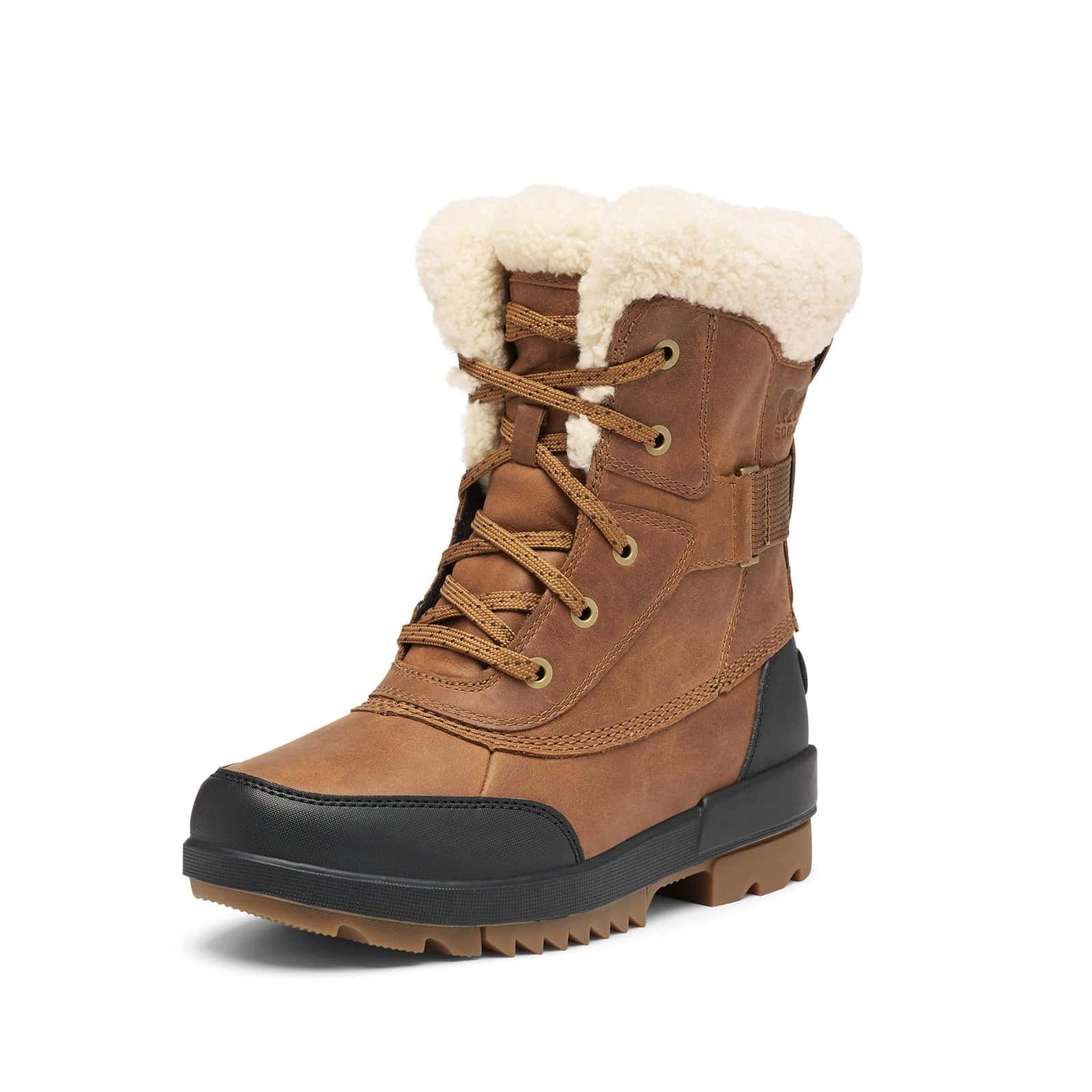 Person walking in deep snow wearing Sorel Caribou boots